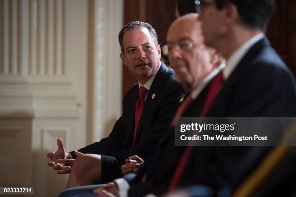 White House Chief of Staff Reince Priebus, talks with others before President Donald Trump announces the first U.S. Assembly plant for electronics...