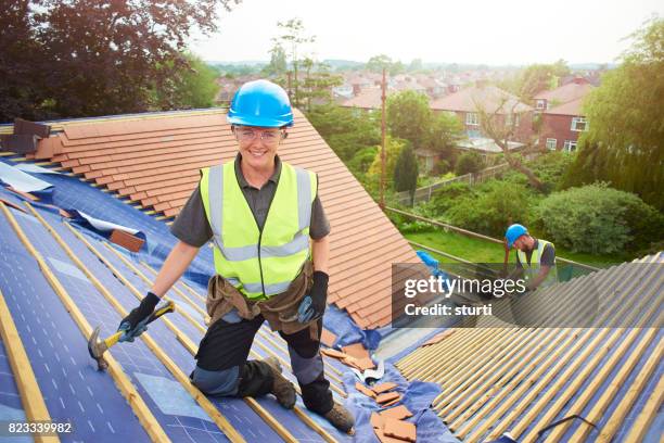 top of her roofing class - roofer stock pictures, royalty-free photos & images