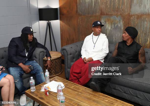 Shaka Senghor, Russell Simmons and Nick Cannon speak backstage during VAN JONES WE RISE TOUR powered by #LoveArmy at Hollywood Palladium on July 26,...