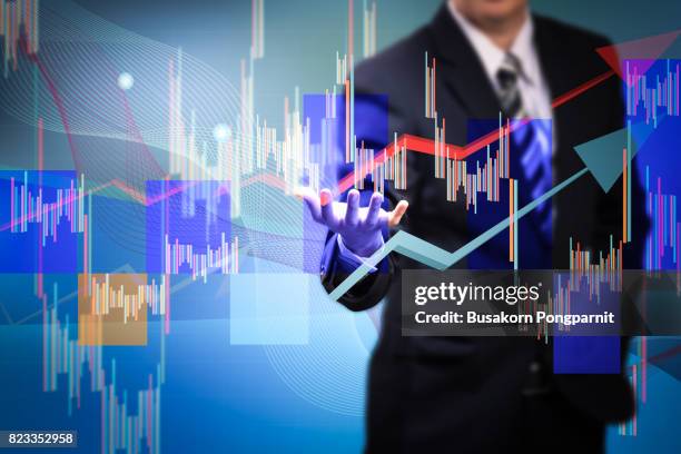 close up of businessman hand presenting digital charts - virtual reality simulator presentation stockfoto's en -beelden