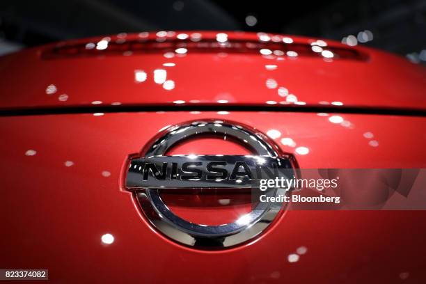 The Nissan Motor Co. Badge is displayed on the back of a Fairlady Z vehicle at the company's showroom in Yokohama, Japan, on Thursday, July 27, 2017....