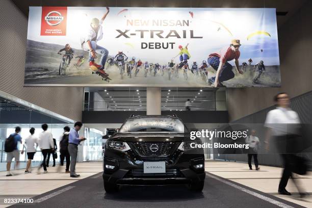 Nissan Motor Co. X-Trail vehicle stands on display outside the company's showroom in Yokohama, Japan, on Thursday, July 27, 2017. Nissan is counting...