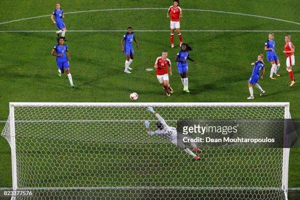 Ana Maria Crnogorcevic of Switzerland heads the opening goal over Sarah Bouhaddi, goalkeeper of France during the Group C match between Switzerland...