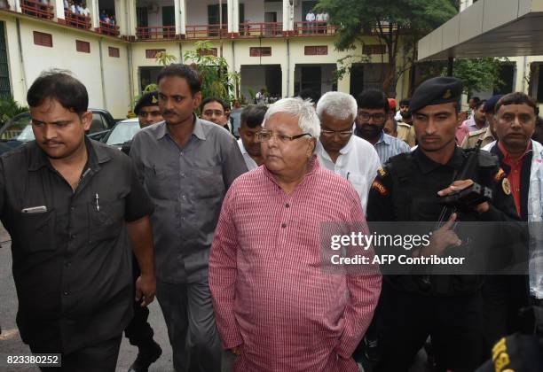 Former chief minister of Bihar state Lalu Prasad Yadav arrives to appear in court in Ranchi on July 27, 2017 in connection with an ongoing corruption...