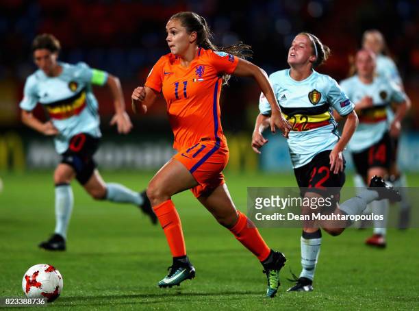 Lieke Martens of Netherlands gets past Laura Deloose of Belgium during the Group A match between Belgium and Netherlands during the UEFA Women's Euro...
