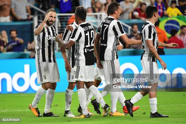 Gonzalo Gerardo Higuain of Juventus celebrates with team mates after putting his side 1-0 ahead during the International Champions Cup match between...