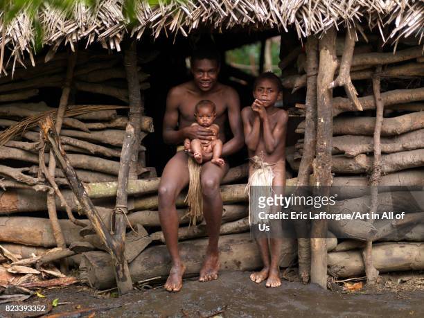 Charly Kala and his nephews from the Big Nambas tribe in front of their house, Tanna island, Yakel, Vanuatu on September 6, 2007 in Yakel, Vanuatu.