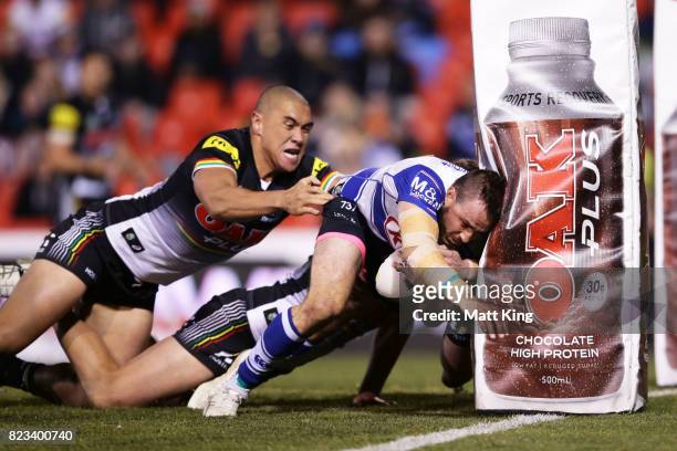 Josh Reynolds of the Bulldogs scores a try during the round 21 NRL match between the Penrith Panthers and the Canterbury Bulldogs at Pepper Stadium...