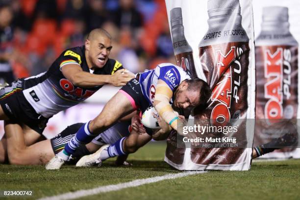 Josh Reynolds of the Bulldogs scores a try during the round 21 NRL match between the Penrith Panthers and the Canterbury Bulldogs at Pepper Stadium...