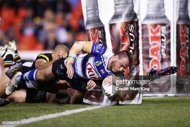 Josh Reynolds of the Bulldogs scores a try during the round 21 NRL match between the Penrith Panthers and the Canterbury Bulldogs at Pepper Stadium...