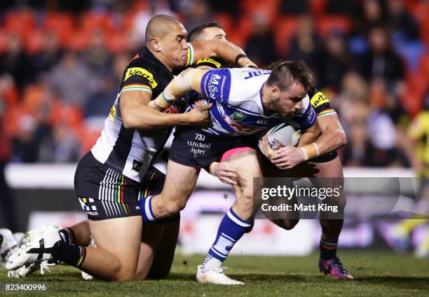 Josh Reynolds of the Bulldogs beats the defence to score a try during the round 21 NRL match between the Penrith Panthers and the Canterbury Bulldogs...