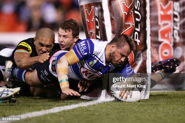 Josh Reynolds of the Bulldogs scores a try during the round 21 NRL match between the Penrith Panthers and the Canterbury Bulldogs at Pepper Stadium...