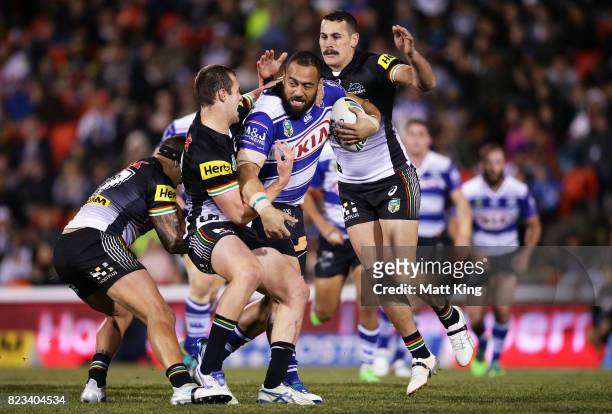 Sam Kasiano of the Bulldogs is tackled during the round 21 NRL match between the Penrith Panthers and the Canterbury Bulldogs at Pepper Stadium on...