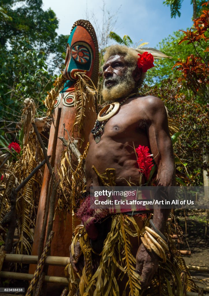 Portrait of chieftain Etul in front of a giant slit drum, Ambrym island, Fanla, Vanuatu...