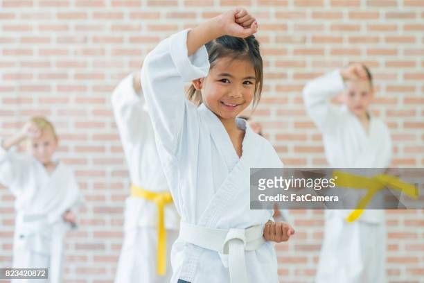 female fighter - tae kwon do stock pictures, royalty-free photos & images