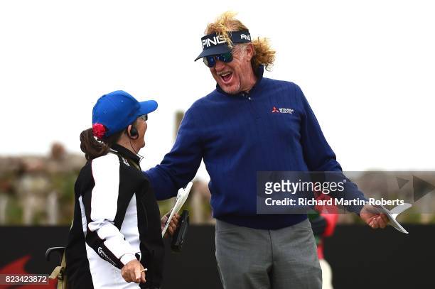 Miguel Angel Jimenez of Spain Jokes with a scorer during the first round of the the Senior Open Championship presented by Rolex at Royal Porthcawl...