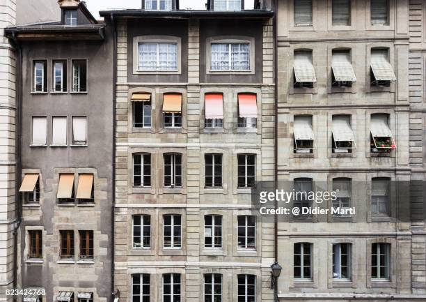 the facade of geneva old town in switzerland - wall building feature stock pictures, royalty-free photos & images