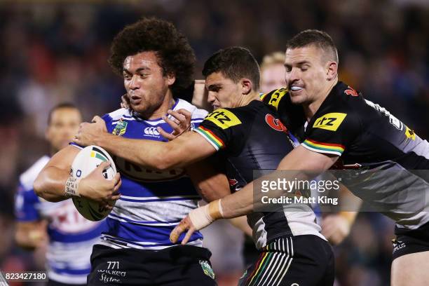 Raymond Faitala-Mariner of the Bulldogs is tackled during the round 21 NRL match between the Penrith Panthers and the Canterbury Bulldogs at Pepper...