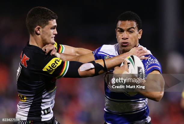Will Hopoate of the Bulldogs puts a fend on Nathan Cleary of the Panthers during the round 21 NRL match between the Penrith Panthers and the...