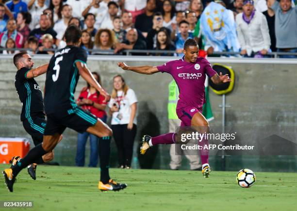 Manchester City defender Danilo,right, drives the ball against Real Madrid during the second half of the International Champions Cup match on July...