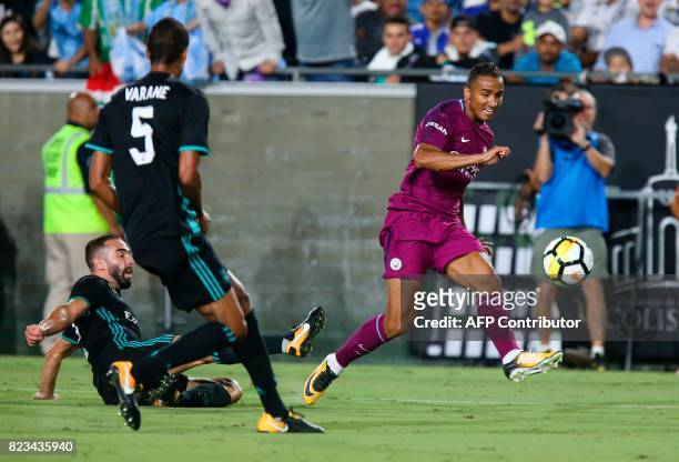 Manchester City defender Danilo, right, kicks the ball against Real Madrid during the second half of the International Champions Cup match on July...