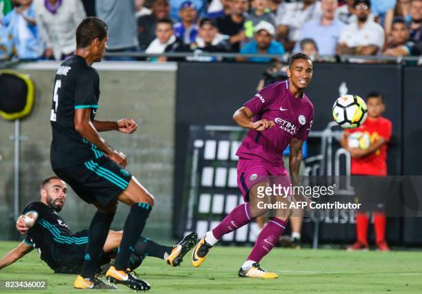 Manchester City defender Danilo, right, kicks the ball against Real Madrid during the second half of the International Champions Cup match on July...
