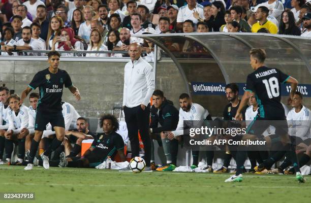 Real Madrid head coach Zinedine Zidane, center, in the second half of the International Champions Cup match against Manchester City on July 26, 2017...