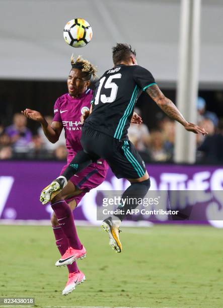Manchester City midfielder Demean Duhaney, left, and Real Madrid defender Theo vie for the ball during the second half of the International Champions...