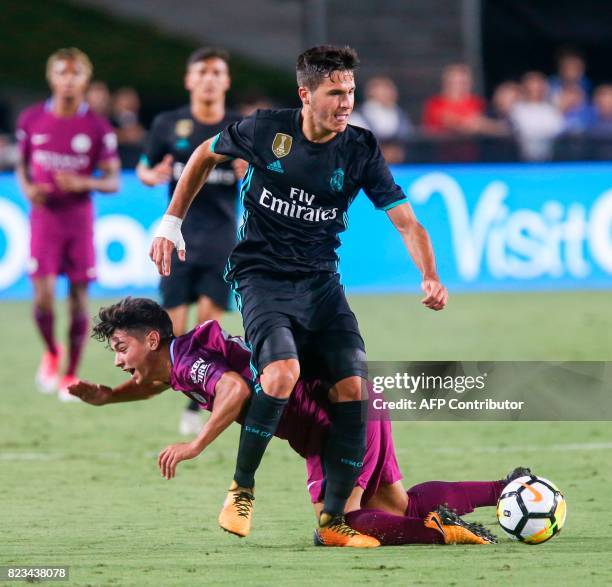 Manchester City midfielder Brahim Diaz, left, vies the ball against Real Madrid during the second half of the International Champions Cup match on...