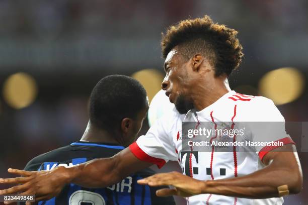 Kingsley Coman of Bayern Muenchen battles for the ball with Geoffrey Kondogbia of Inter during the International Champions Cup 2017 match between...
