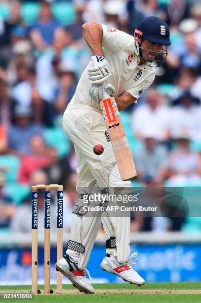 England's Alastair Cook plays a shot on the first day of the third Test match between England and South Africa at The Oval cricket ground in London...
