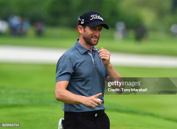 Gregory Bourdy of France acknowledges the applause from the croud as he finishes his first round during the Porsche European Open - Day One at Green...