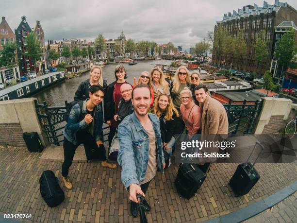 selfie with a group of friends on vacation - tourist group stock pictures, royalty-free photos & images