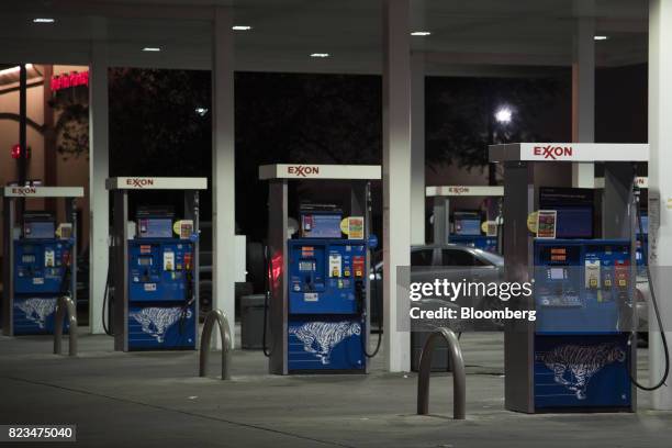 Fuel pumps stand at an Exxon Mobil Corp. Gas station in Dallas, Texas, U.S., on Monday, July. 24, 2017. Exxon Mobil Corp. Is scheduled to release...