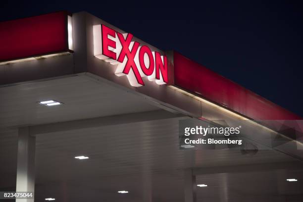 Exxon Mobil Corp. Signage is displayed at a gas station in Dallas, Texas, U.S., on Monday, July. 24, 2017. Exxon Mobil Corp. Is scheduled to release...