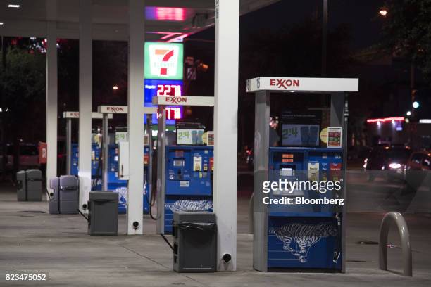 Fuel pumps stand at an Exxon Mobil Corp. Gas station in Dallas, Texas, U.S., on Monday, July. 24, 2017. Exxon Mobil Corp. Is scheduled to release...
