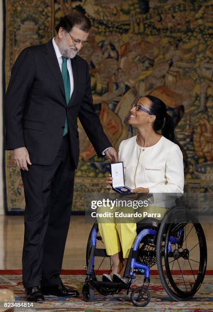 President Mariano Rajoy and swimmer Teresa Perales attend the 'Medals to Merit in Work' delivery at Moncloa palace July 27, 2017 in Madrid, Spain.