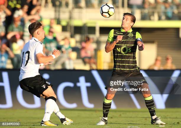 Sporting CP midfielder Adrien Silva from Portugal with Vitoria Guimaraes forward Helder Ferreira from Portugal in action during Pre-Season Friendly...