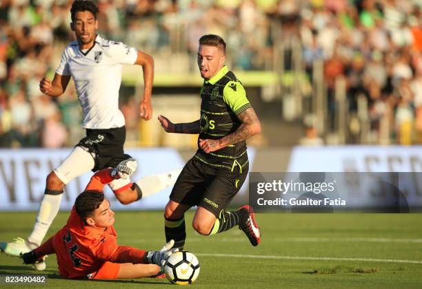 Sporting CP midfielder Iuri Medeiros from Portugal with Vitoria Guimaraes goalkeeper Miguel Oliveira from Portugal and Vitoria Guimaraes defender...