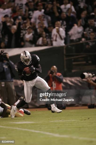 Hiram Eugene of the Oakland Raiders makes an interception against the San Francisco 49ers during the pre-season game at McAfee Coliseum on August 8,...