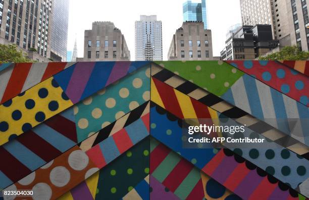Artists Jason Woodside and JM Rizzi's graffiti murals are on dispay in the middle of the Rockefeller Plaza July 27, 2017 in New York city. The three...