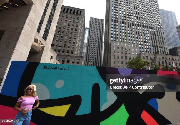 Artists Jason Woodside and JM Rizzi's graffiti murals are on dispay in the middle of the Rockefeller Plaza July 27, 2017 in New York city. The three...