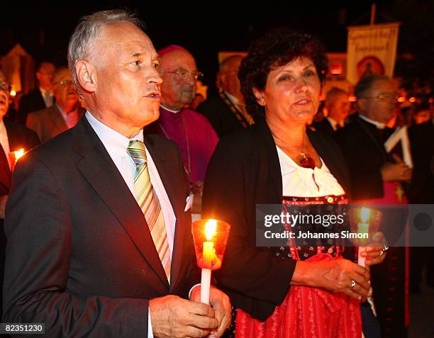 Erwin Huber , head of the Christian Social Union and politician Ingrid Heckner are seen during a katholic light procession on August 14, 2008 in...