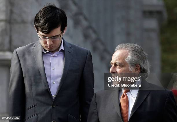 Martin Shkreli, former chief executive officer of Turing Pharmaceuticals AG, left, arrives at federal court with his attorney Benjamin Brafman in the...