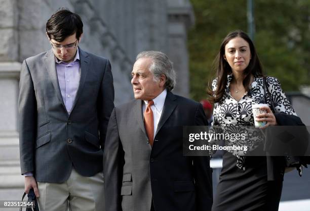 Martin Shkreli, former chief executive officer of Turing Pharmaceuticals AG, left, arrives at federal court with his attorney Benjamin Brafman,...