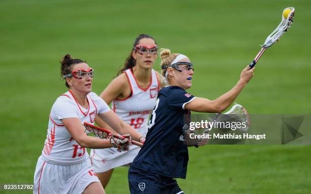 Becca Block of the United States is challenged by Kamila Sadowska of Poland during the Lacrosse Women's match between USA and Poland of The World...