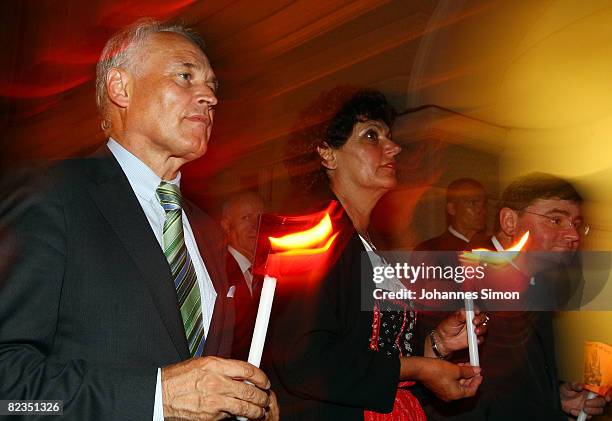 Erwin Huber , head of the Christian Social Union and politician Ingrid Heckner are seen during a katholic light procession on August 14, 2008 in...