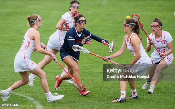 Kelly Rabil of the United States breaks through the defence of Poland during the Lacrosse Women's match between USA and Poland of The World Games at...