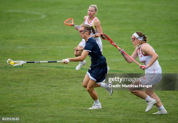 Devon Wills of the United States is tracked by Joanna Wawrzynow of Poland during the Lacrosse Women's match between USA and Poland of The World Games...