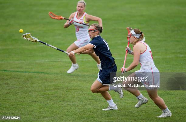 Devon Wills of the United States is tracked by Joanna Wawrzynow of Poland during the Lacrosse Women's match between USA and Poland of The World Games...